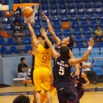 Jasper Magno ekes out a lay-up disregarding the pressure of the three squires.