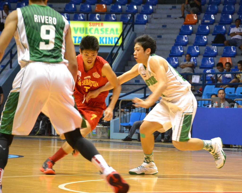Jeremy Cruz tries hard to penetrate the tight defense of the Greenies
